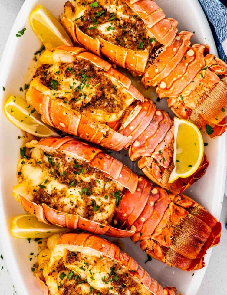 lobster tails on a white serving platter.