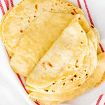 overhead shot of freshly made chinese pancakes around a clean towel.