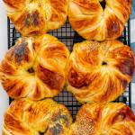 overhead shot of brioche buns cooling on a cooling rack.