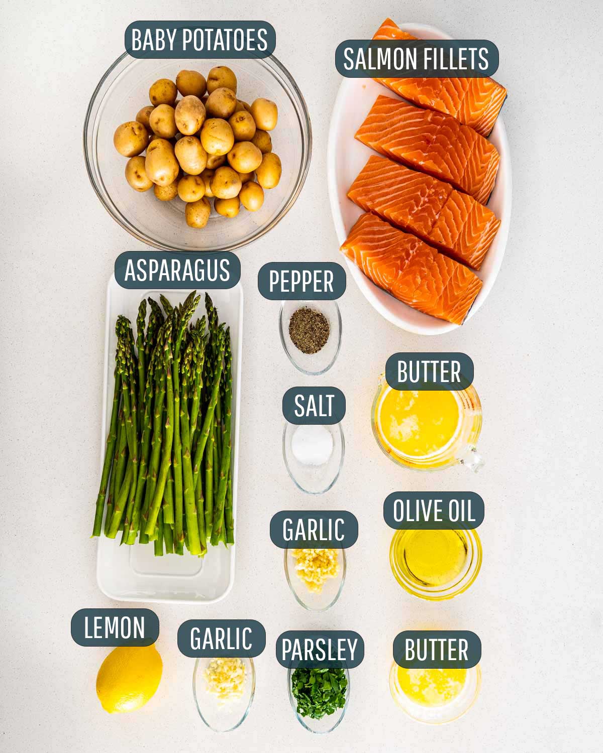 ingredients needed to make garlic butter salmon with baby potatoes and asparagus.