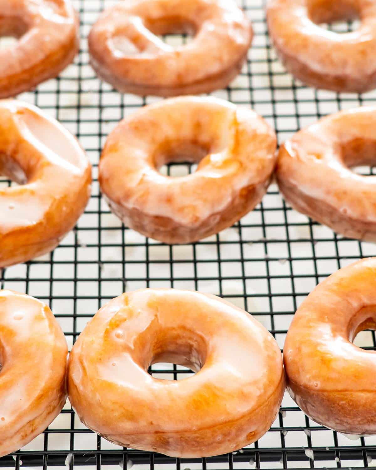 glazed donuts on a cooling rack.