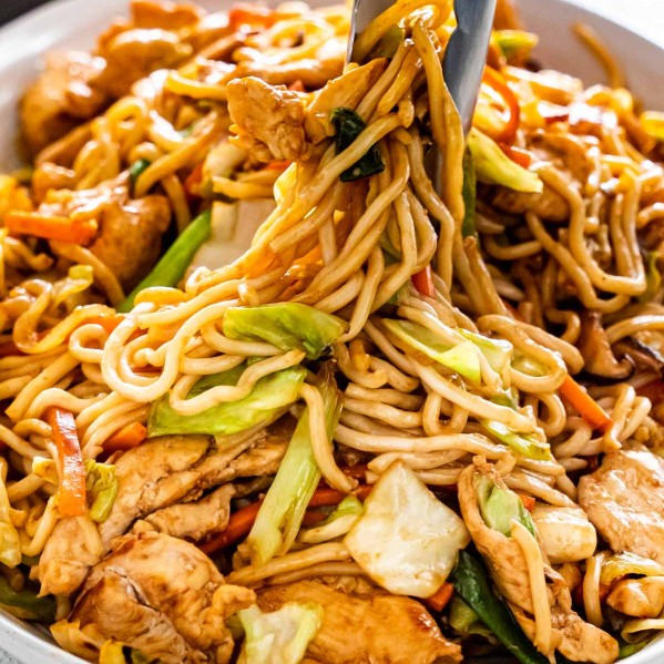 yakisoba noodles with chicken and vegetables in a large serving platter.