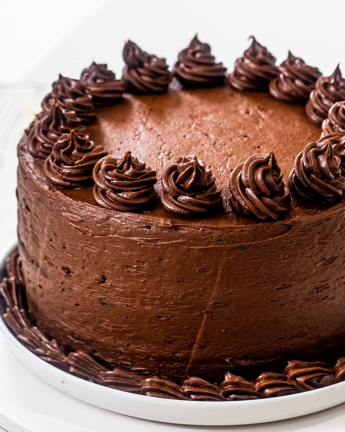 a cake frosted with chocolate frosting.