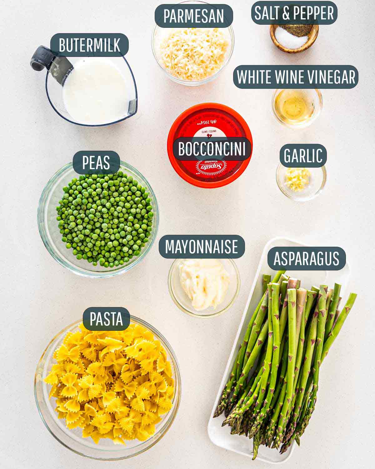 overhead ingredients needed to make asparagus and peas pasta salad.