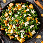roasted pumpkin panzanella salad in a metal platter.