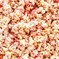 candy cane popcorn in a popcorn container.