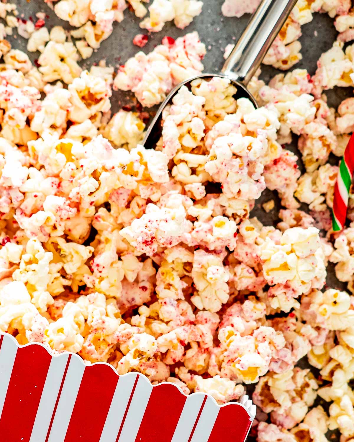 candy cane popcorn in a popcorn container.