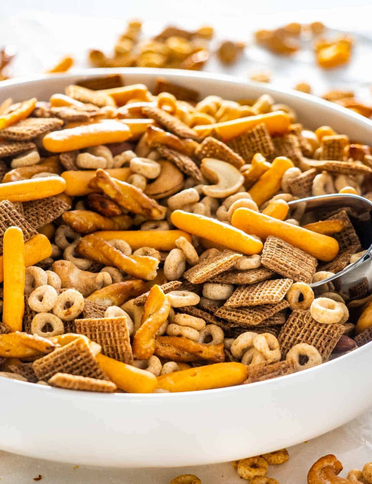 chex mix in a white bowl.