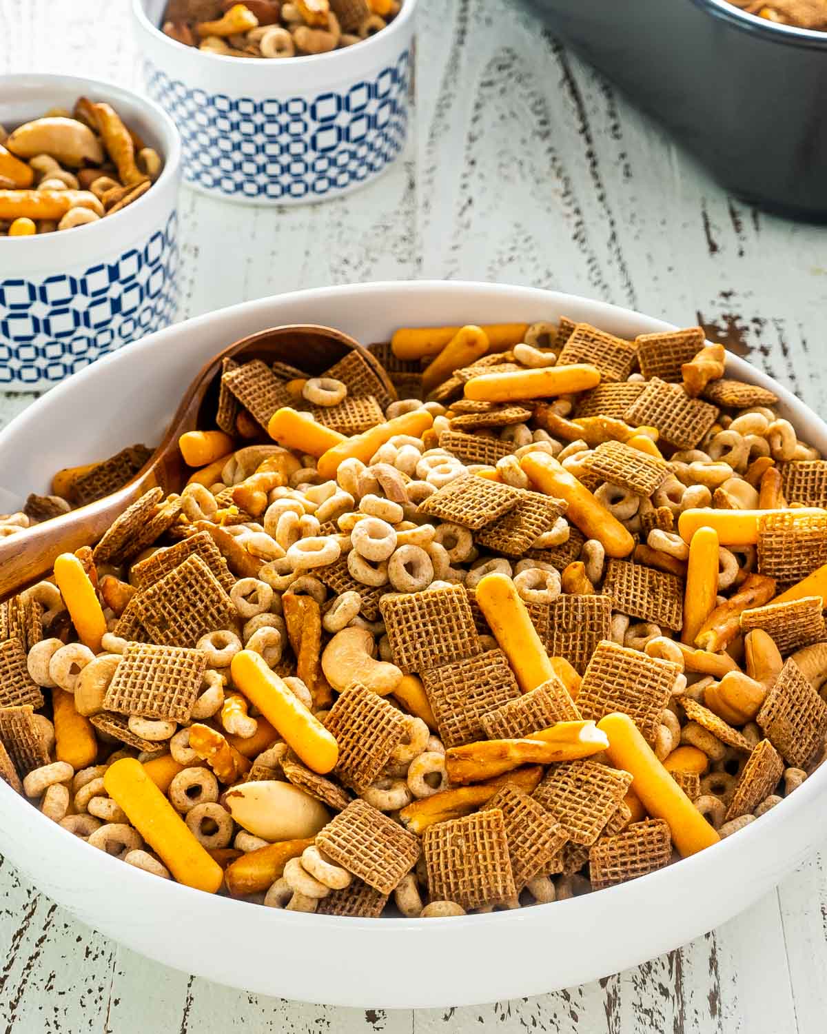 chex mix in a white bowl.