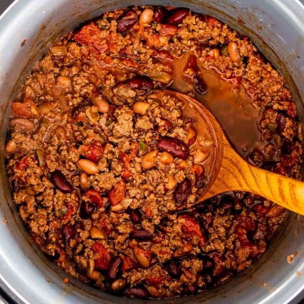 chili made in an instant pot with a ladle inside.