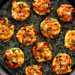 zucchini pizza bites on a serving platter.