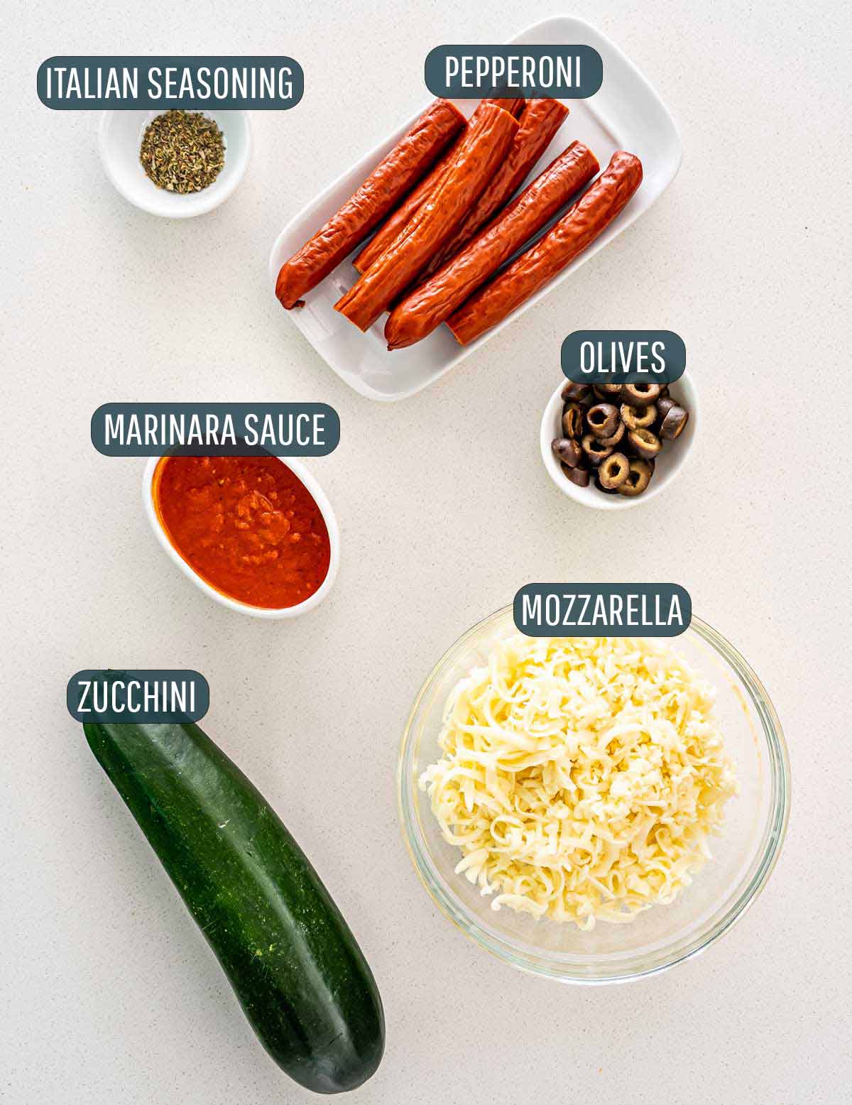 overhead shot of ingredients needed to make zucchini pizza bites.