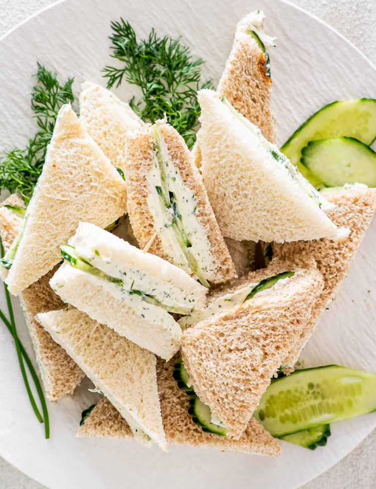 mini cucumber sandwiches on a white plate.