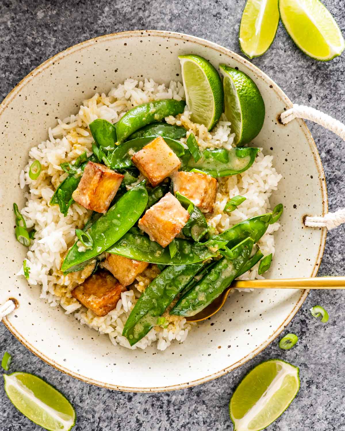 green curry with tofu over a bed of rice.