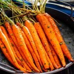 freshly made honey roasted carrots on a plate.