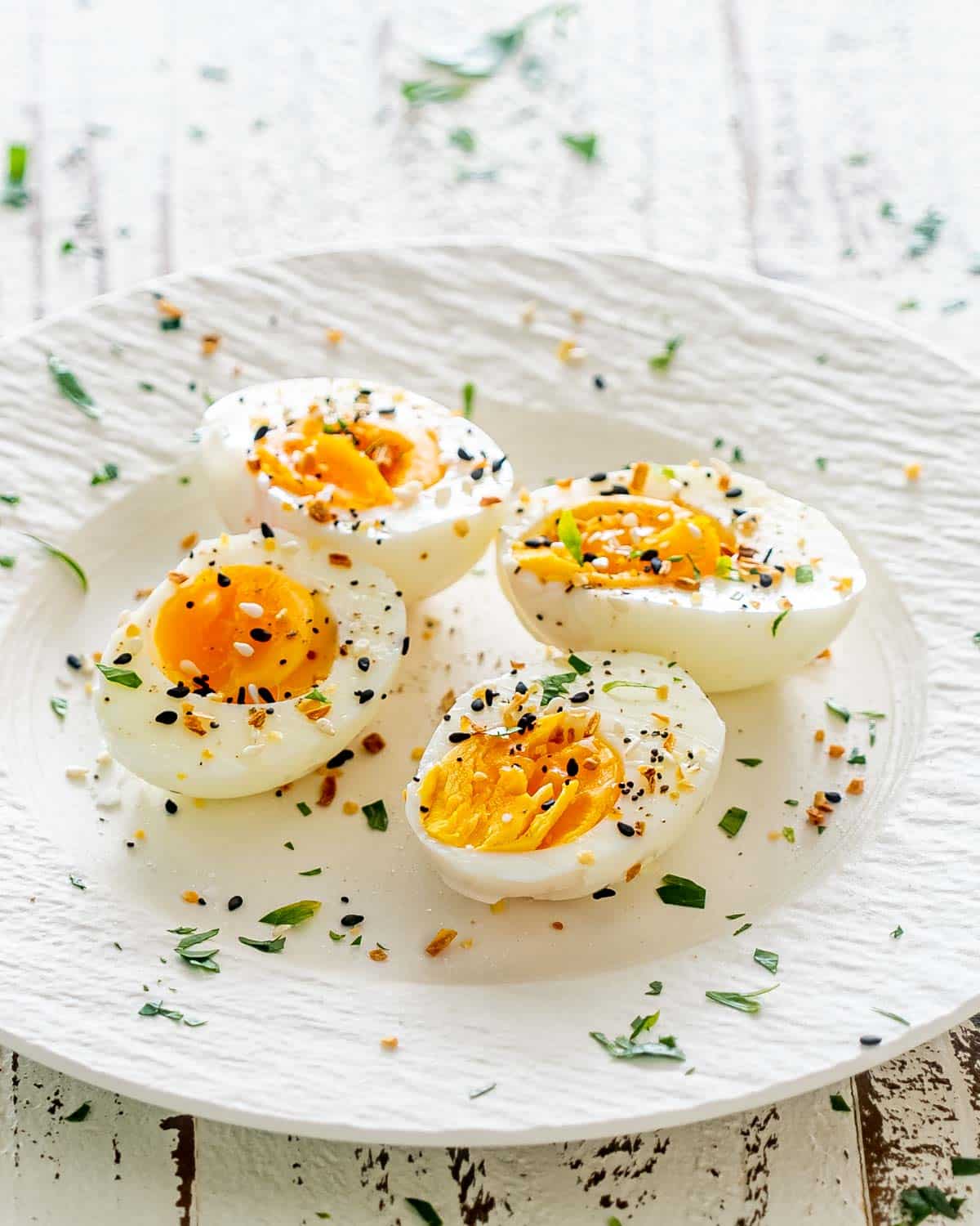 two hard boiled eggs cut in half and seasoned with everything bagel seasoning.