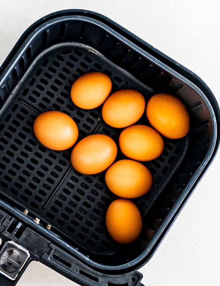 eggs inside an air fryer basket.