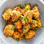 lemon chicken made in the air fryer in a blue bowl.