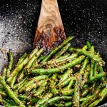 asian green beans in a wok.