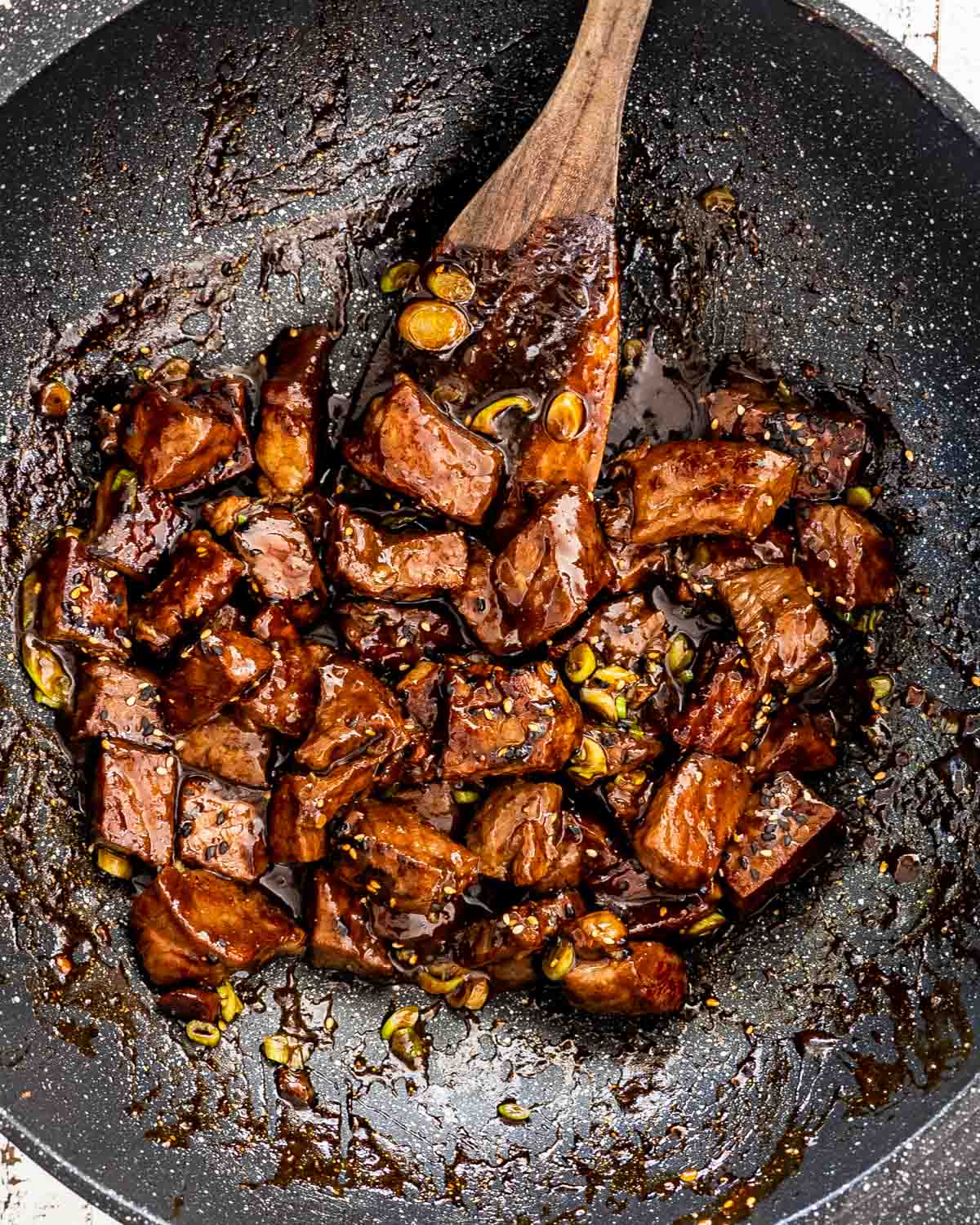 freshly made asian steak bites in a wok.