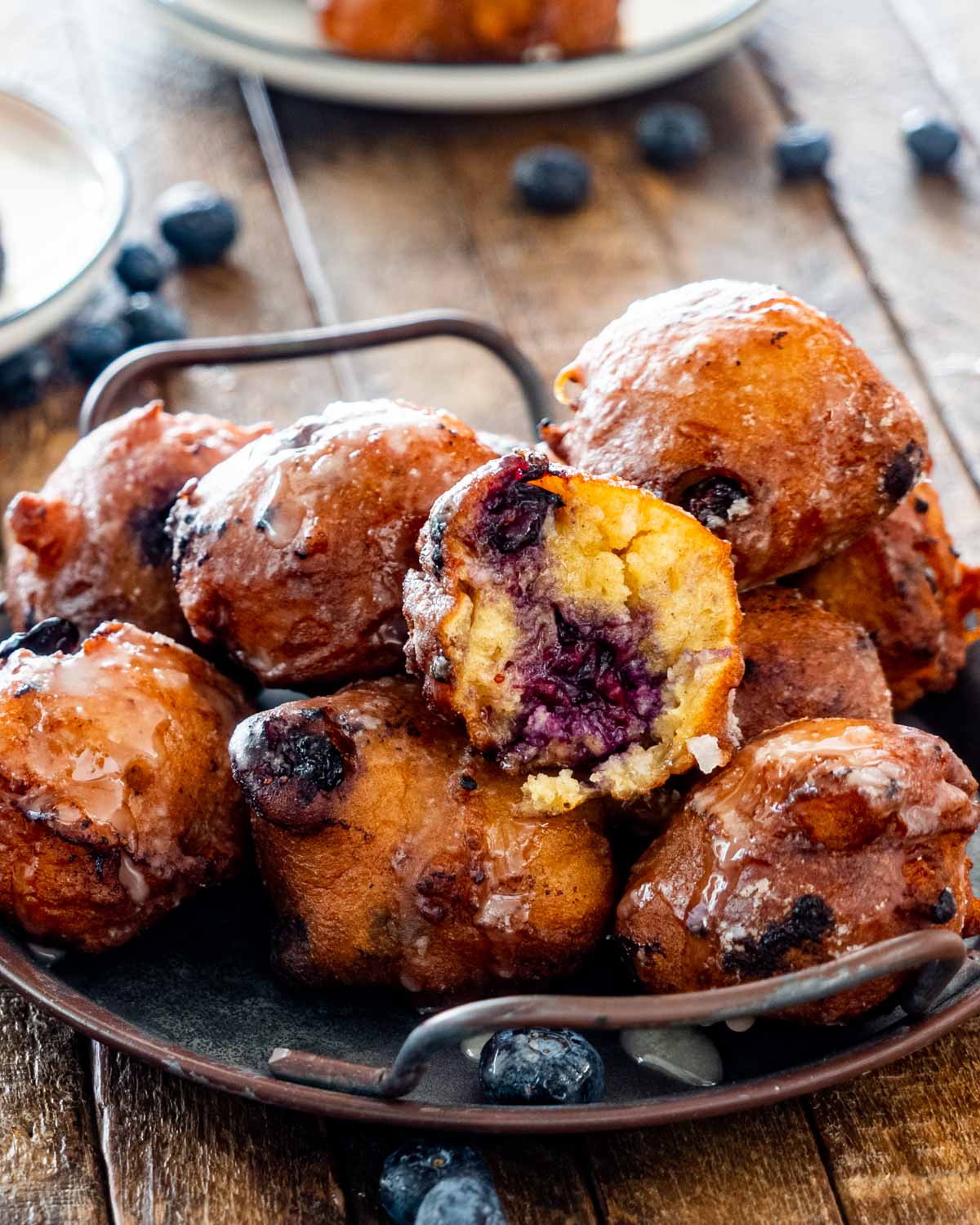 blueberry fritters on a plate.