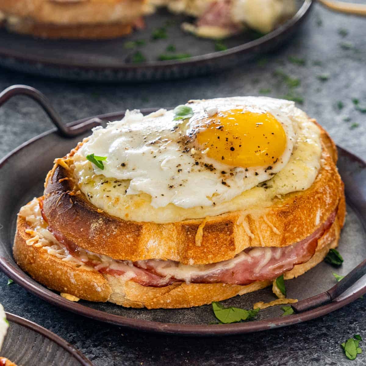 a croque madame on a plate.