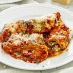 stuffed manicotti on a plate.