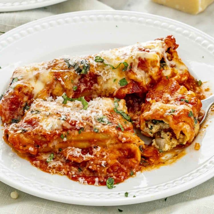 stuffed manicotti on a plate.