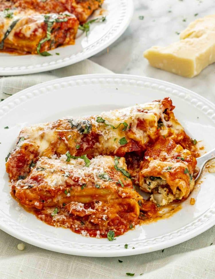 stuffed manicotti on a plate.