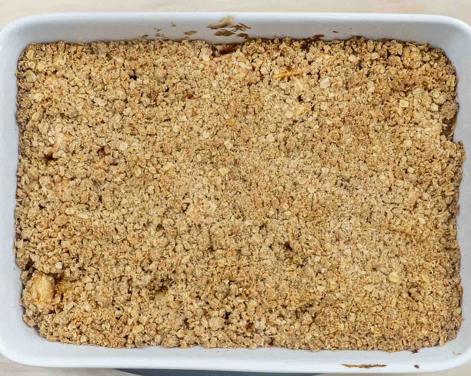 process shots showing how to make apple crumble.