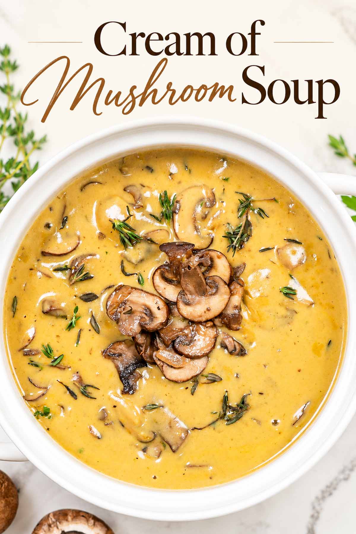 Cream of mushroom soup in a white bowl, topped with sliced mushrooms and thyme beneath the recipe title.