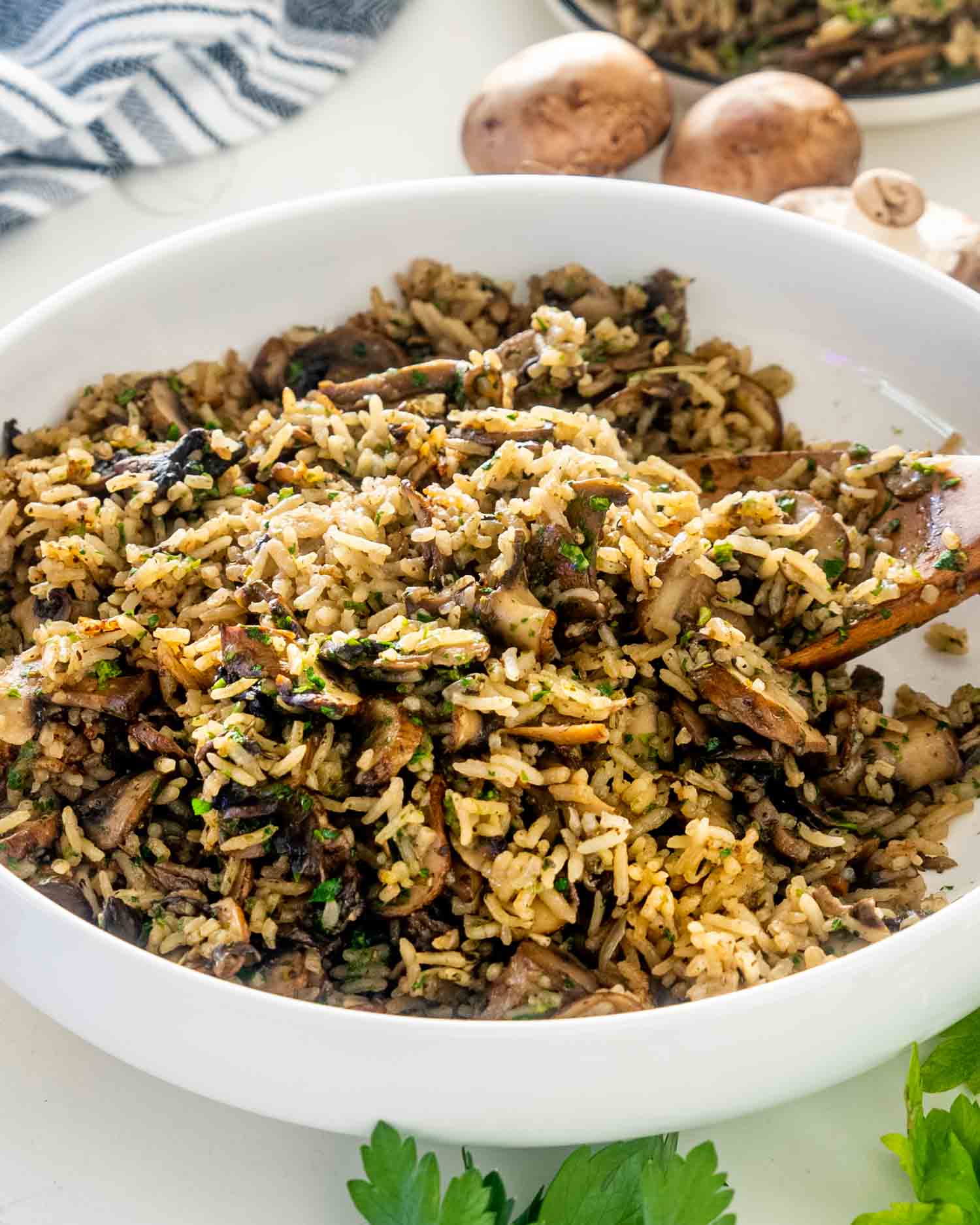 mushroom rice in a large white bowl.