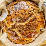 no knead potato bread fresh out of the oven in a dutch oven.