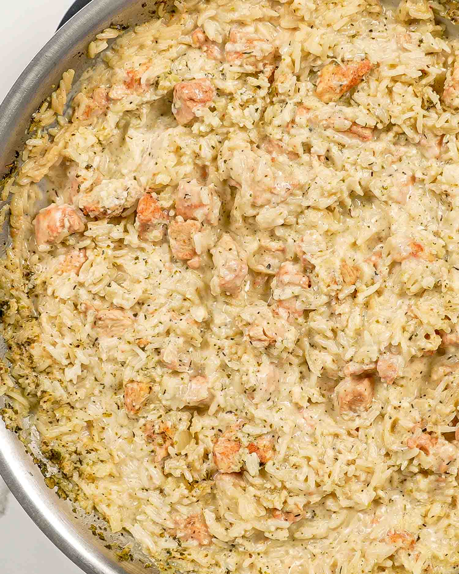 creamy chicken and rice in a skillet.
