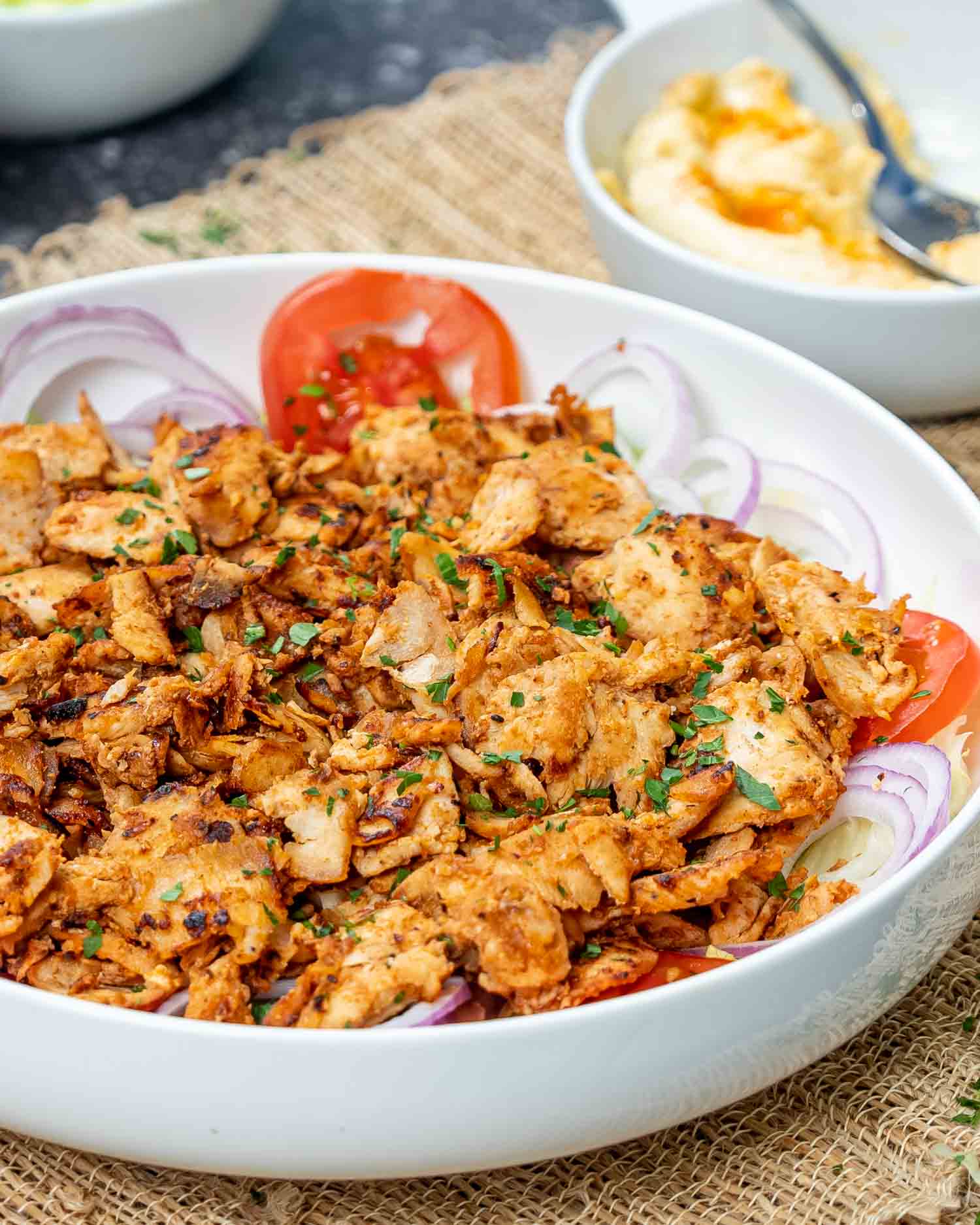 chicken doner kebab in a white bowl.