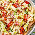 freshly made blt pasta salad in a white pasta bowl.