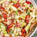 freshly made blt pasta salad in a white pasta bowl.