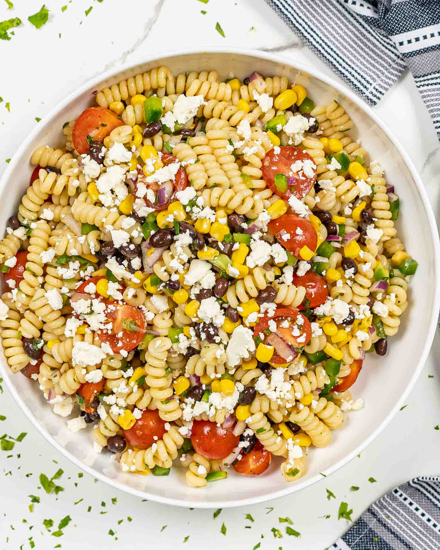 a serving of southwest pasta salad in a white bowl.