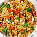 a white bowl with freshly made caprese salad.
