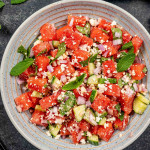 fresh watermelon salad in a blue bowl.