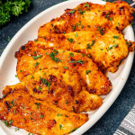 hot honey chicken made in the air fryer on a white platter.