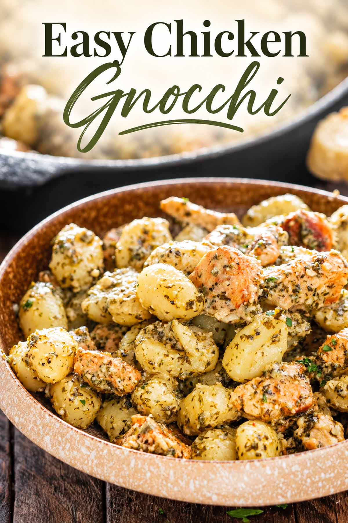 Close-up bowl of herb-coated chicken and tender gnocchi in garlic butter sauce beneath an elegant green recipe title.