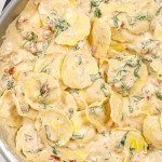 freshly made creamy ravioli in a skillet.