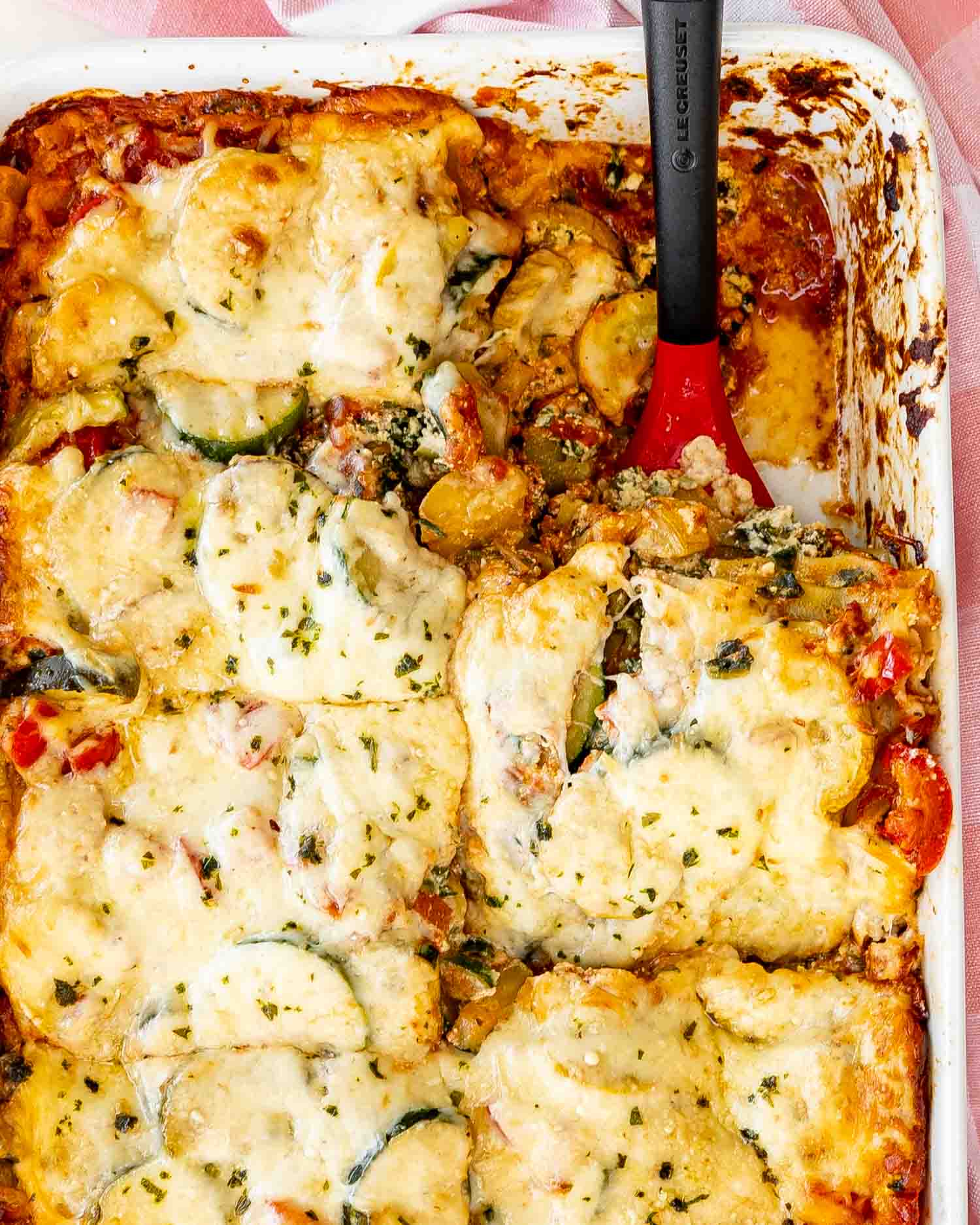 vegetable lasagna in a casserole dish fresh out of the oven.