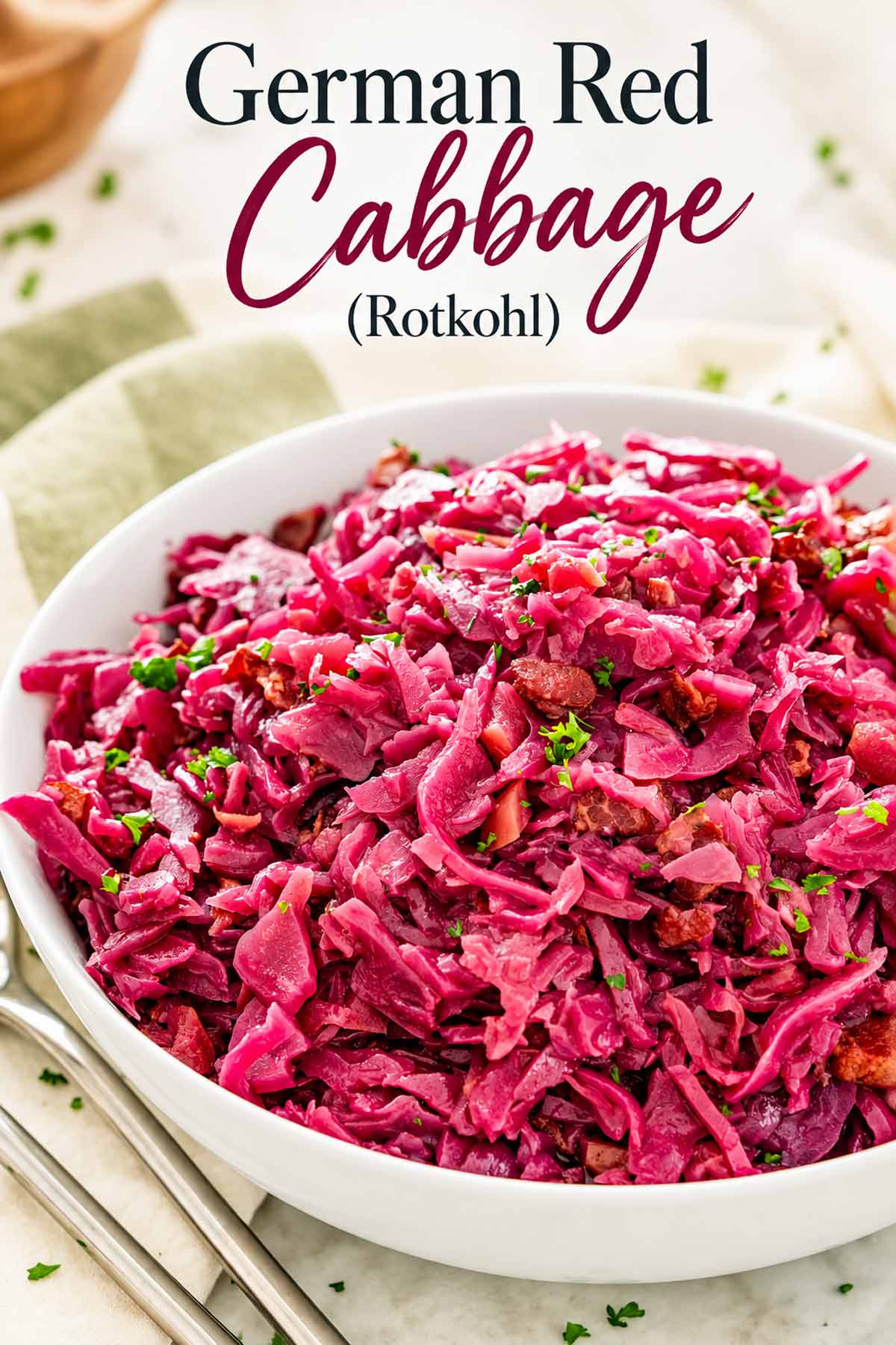Close-up of glossy German red cabbage with parsley in a white bowl, beneath the “German Red Cabbage (Rotkohl)” title.