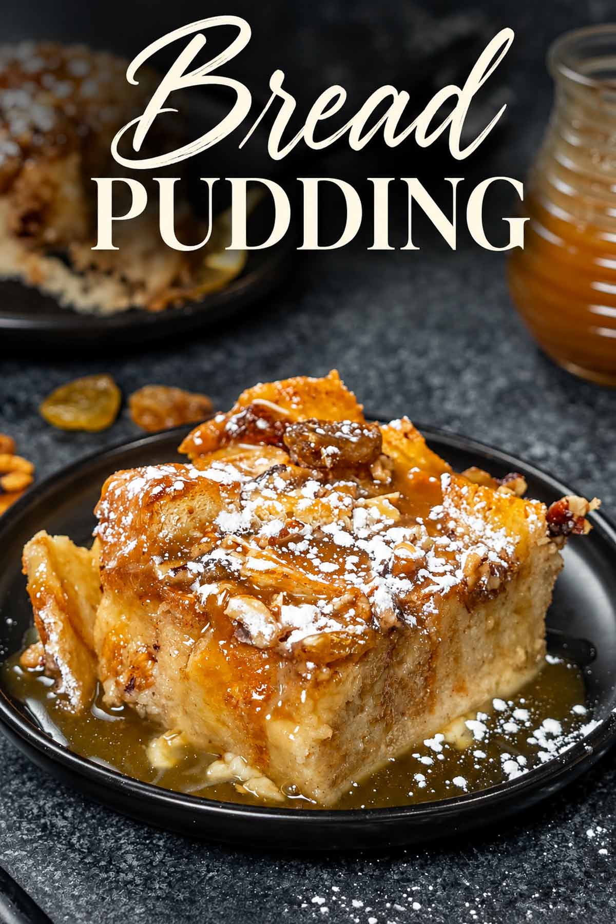 A saucy slice of bread pudding dusted with powdered sugar beneath an elegant Bread Pudding title.