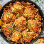 freshly made chicken marengo in a black cast iron skillet.