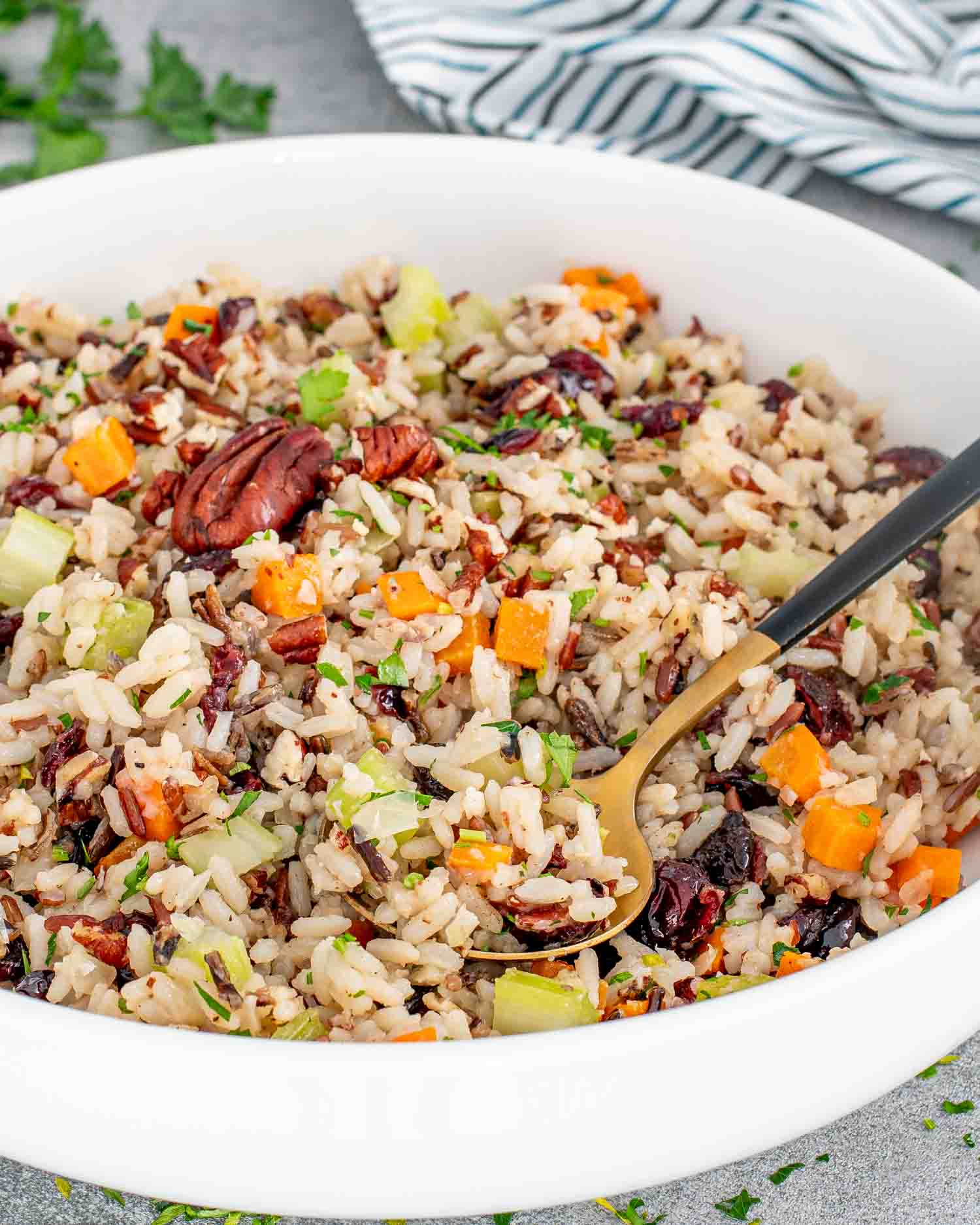 a white bowl filled with wild rice pilaf.