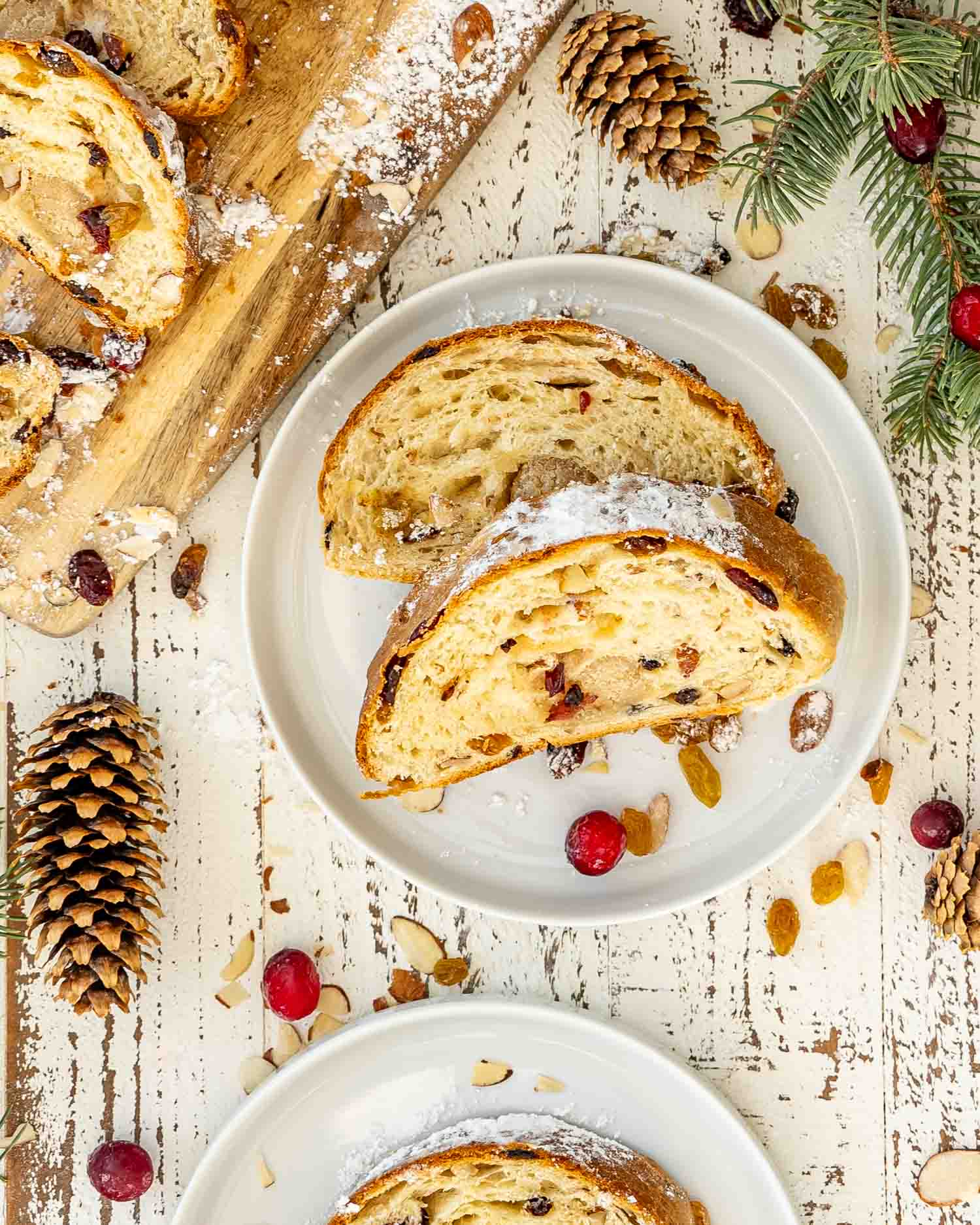 two slices of stollen on a white plate.