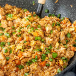 freshly made chicken fried rice in a wok.